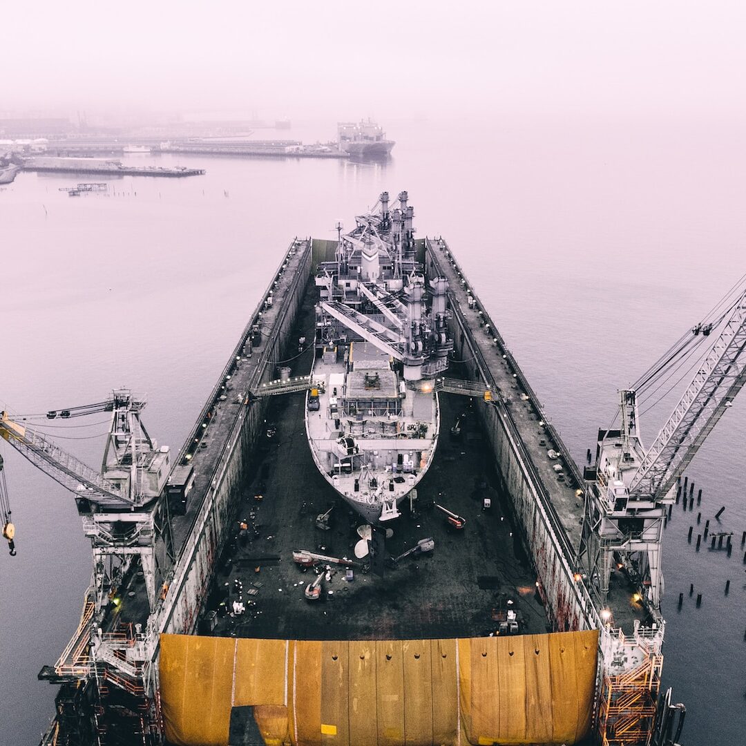 photo of ship on inside oil rig